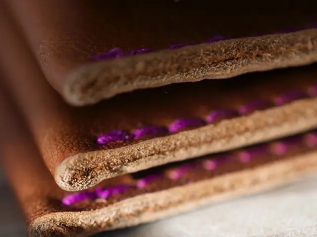 Archaeologists unearth trove of leather goods, including shoes, bags, and sword sheaths, during...