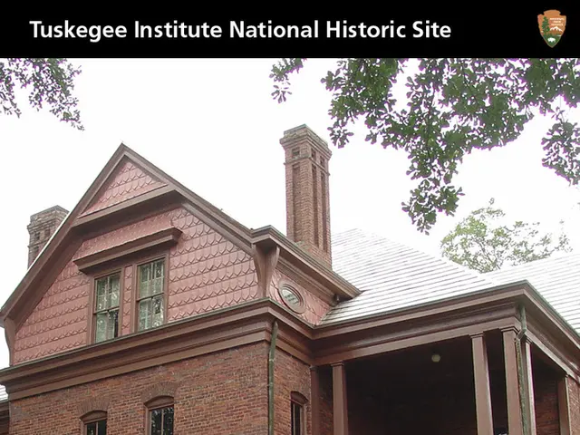 In this image there is a building in the middle. At the top there is the sky. In front of the...